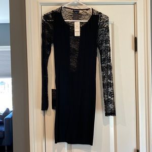Bebe stretchy bodycon dress.  Lace back and sleeves